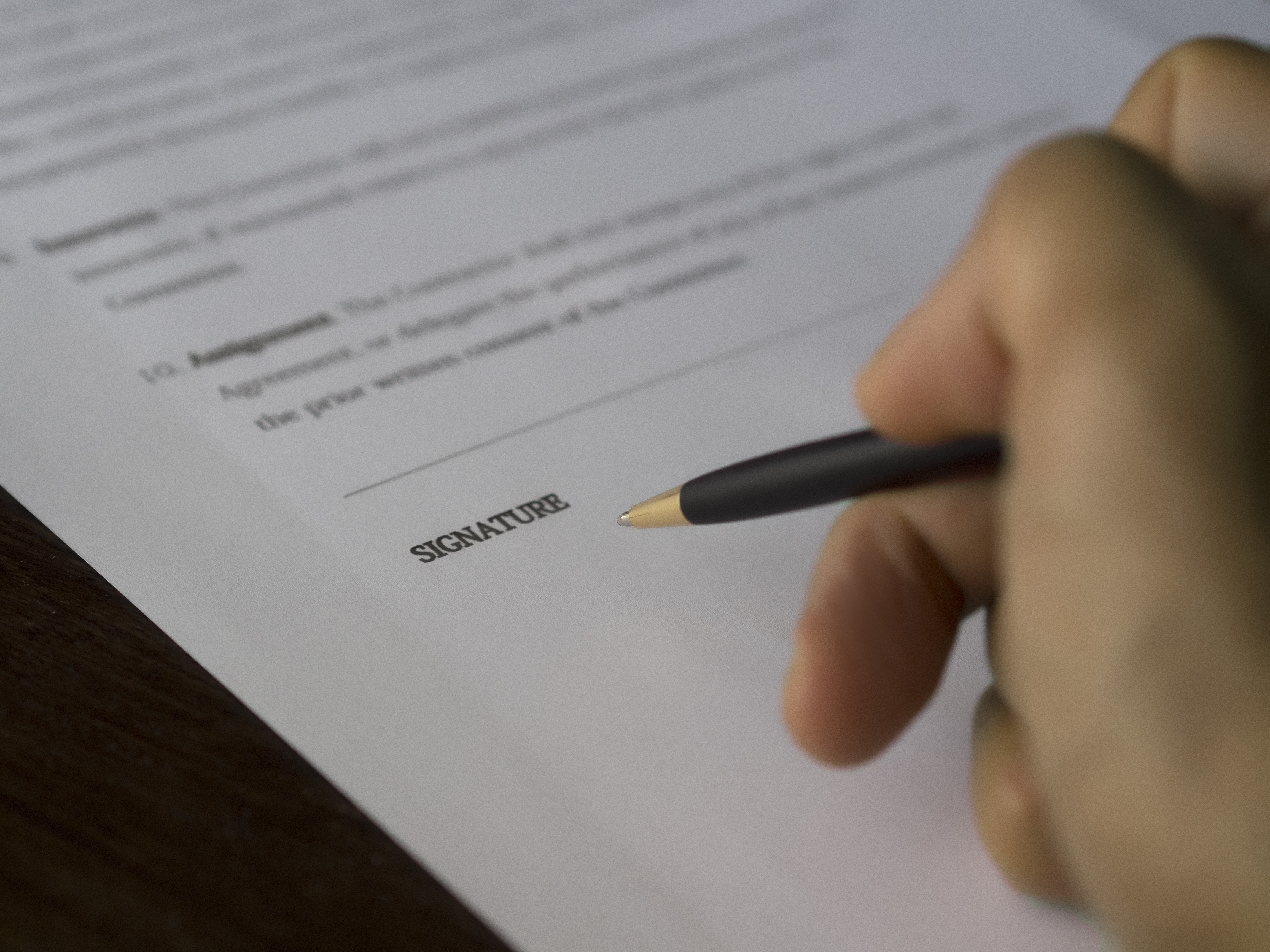 person signing a title loan contract