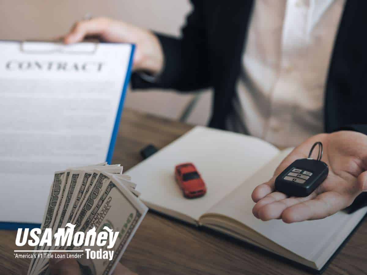 Person holding car keys and cash next to a contract, representing the process of getting a Title Loan