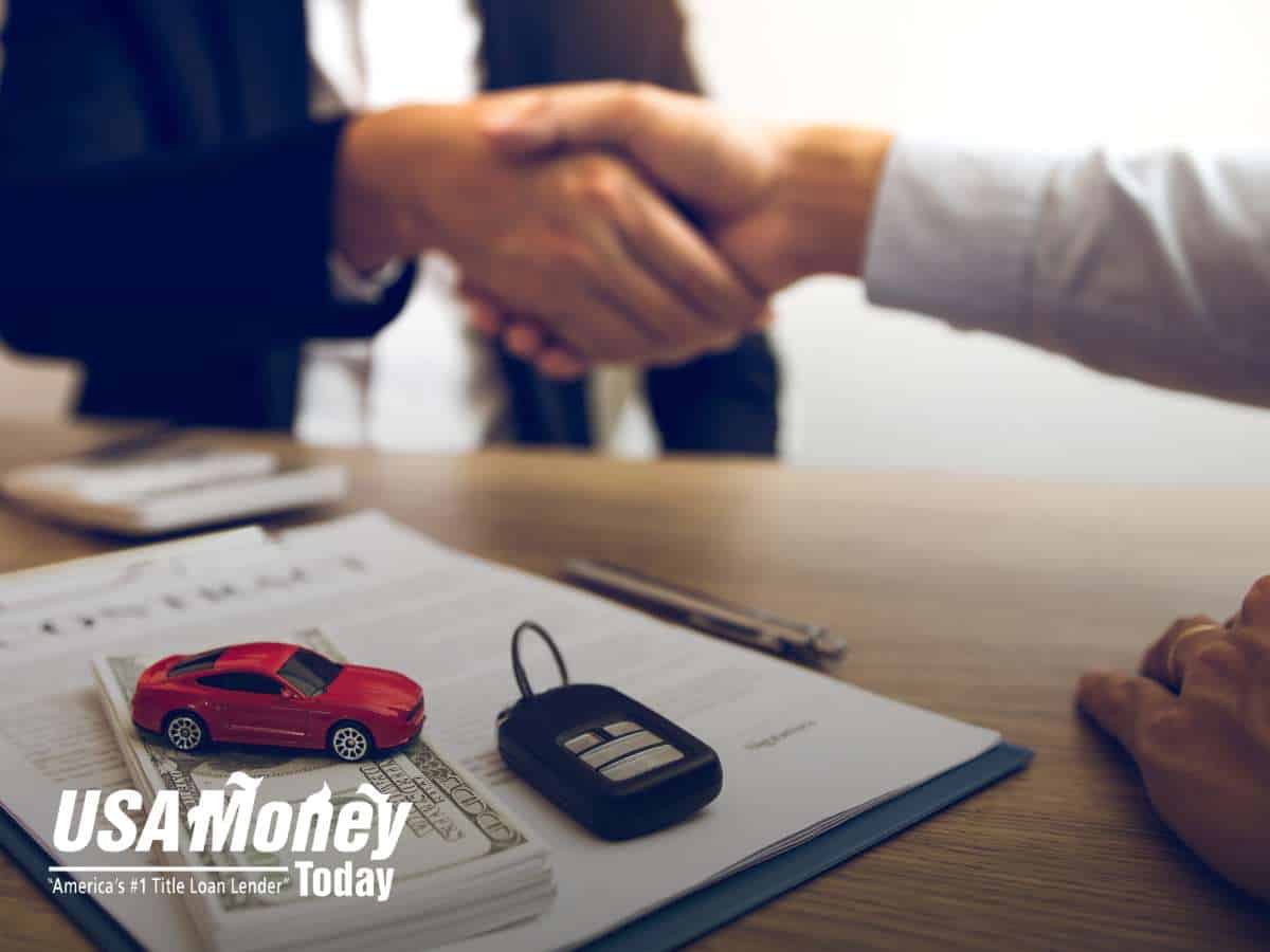 Signing title loan documents for quick cash with Nevada Title Loans